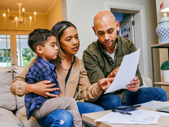 Family looking at sheet